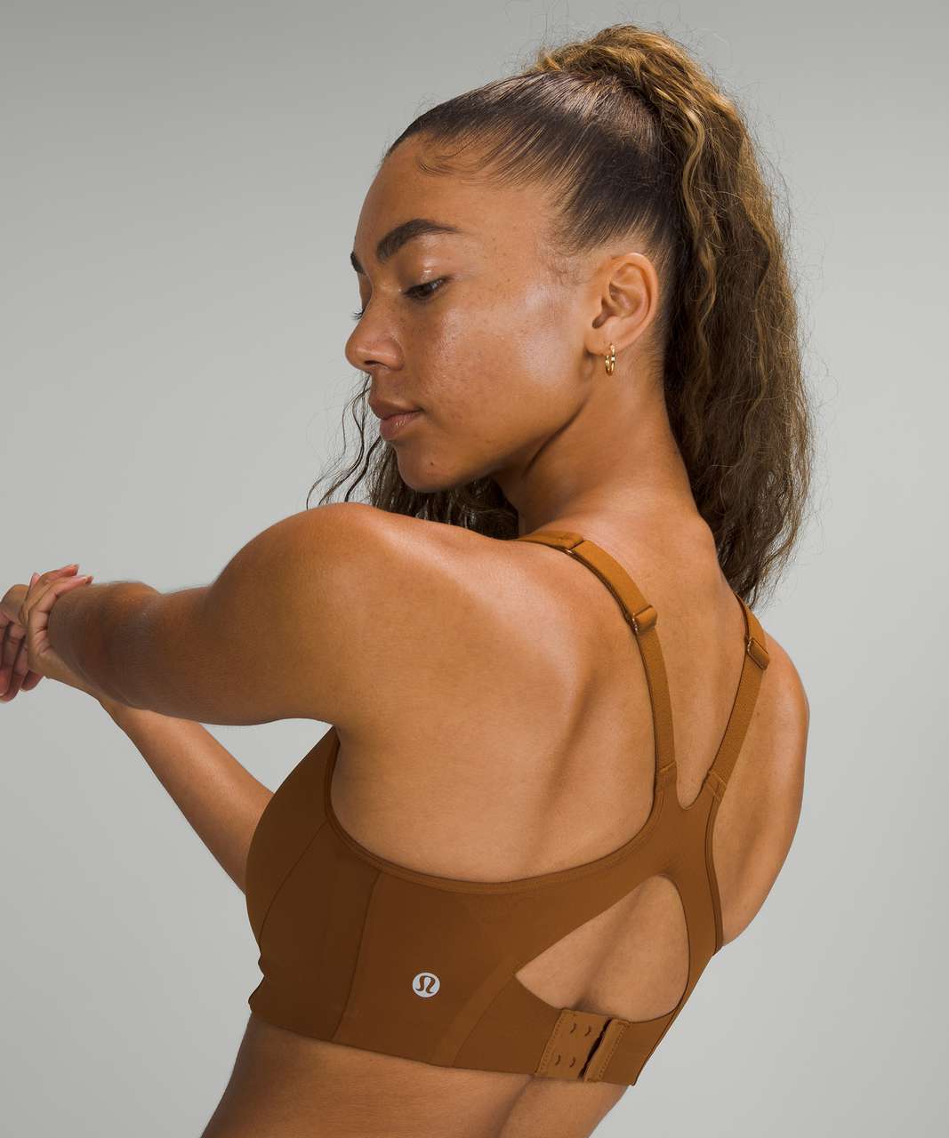 https://storage.googleapis.com/lulu-fanatics/product/66934/1280/lululemon-all-powered-up-bra-medium-support-a-g-cups-copper-brown-049076-364820.jpg