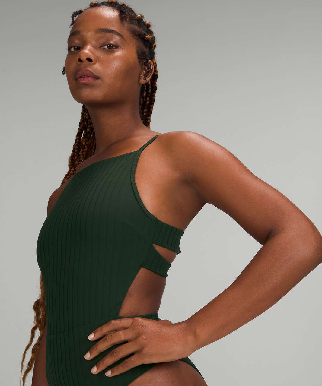 https://storage.googleapis.com/lulu-fanatics/product/67713/1280/lululemon-ribbed-high-neck-cross-back-one-piece-rainforest-green-049106-368235.jpg