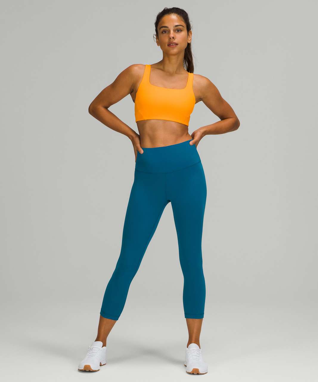 https://storage.googleapis.com/lulu-fanatics/product/67917/1280/lululemon-ribbed-train-bra-medium-support-c-d-cups-clementine-049075-369234.jpg