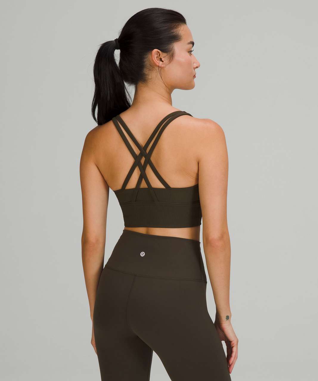 https://storage.googleapis.com/lulu-fanatics/product/68527/1280/lululemon-energy-longline-bra-ribbed-luxtreme-medium-support-b-d-cups-dark-olive-026083-372093.jpg