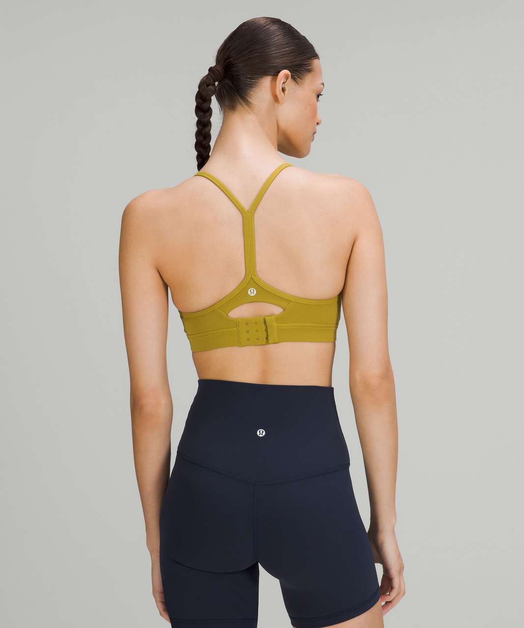 https://storage.googleapis.com/lulu-fanatics/product/70274/1280/lululemon-flow-y-adjustable-bra-light-support-a-c-cups-auric-gold-048492-379627.jpg