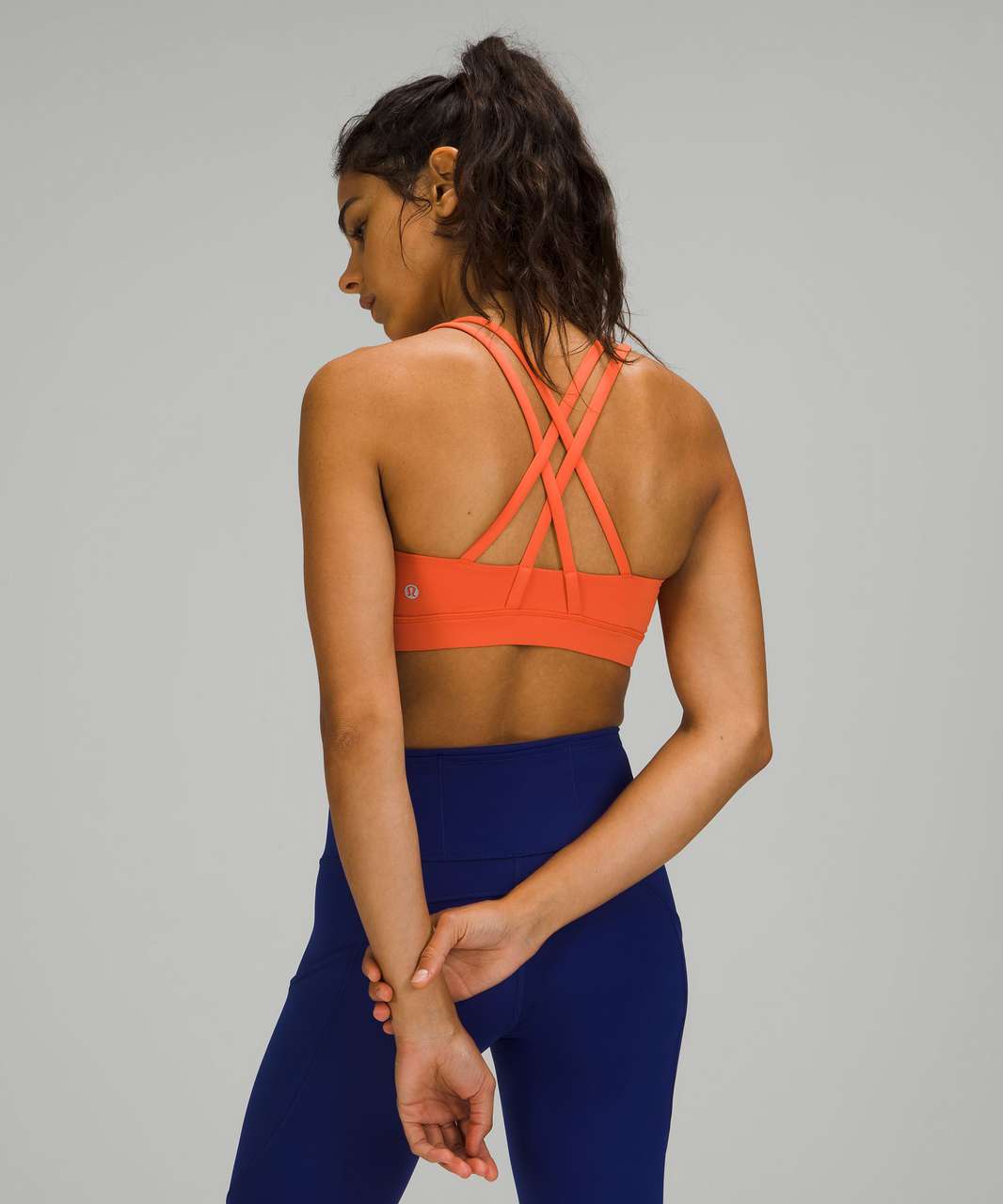 https://storage.googleapis.com/lulu-fanatics/product/70881/1280/lululemon-energy-bra-medium-support-b-d-cups-warm-coral-048227-380736.jpg