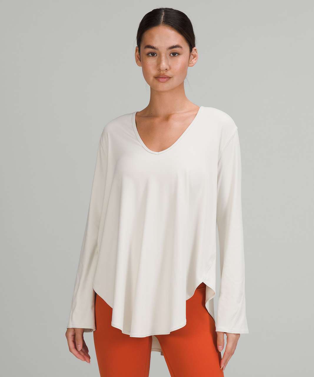 https://storage.googleapis.com/lulu-fanatics/product/71283/1280/lululemon-nulu-relaxed-fit-yoga-long-sleeve-shirt-white-opal-047748-382594.jpg