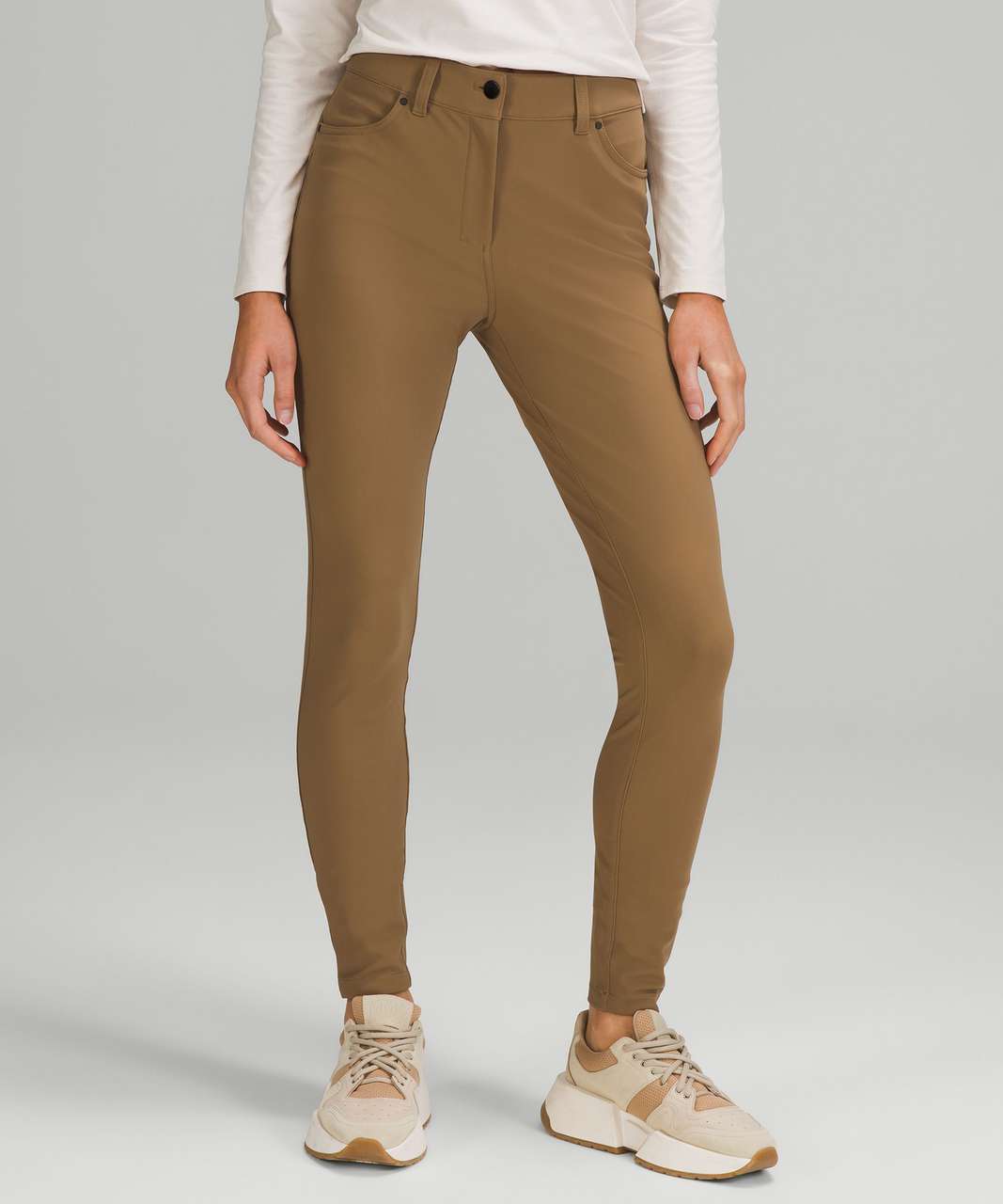 https://storage.googleapis.com/lulu-fanatics/product/71915/1280/lululemon-city-sleek-slim-fit-5-pocket-high-rise-pant-artifact-artifact-054923-385639.jpg