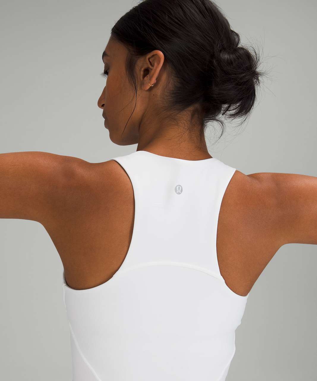 https://storage.googleapis.com/lulu-fanatics/product/72810/1280/lululemon-invigorate-training-tank-top-white-0002-389868.jpg