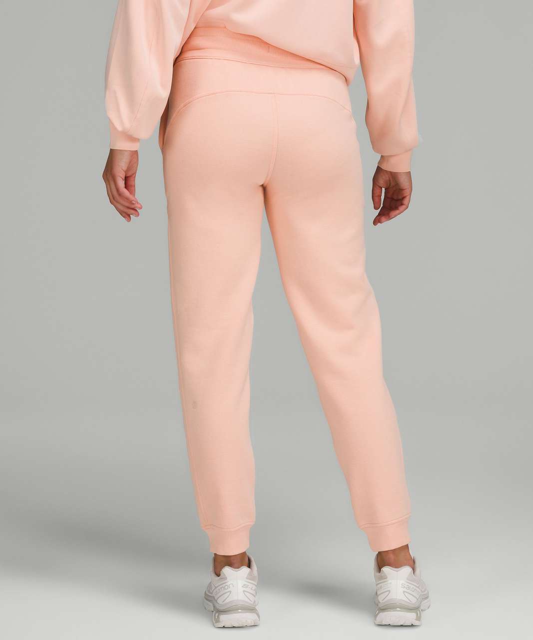 https://storage.googleapis.com/lulu-fanatics/product/72878/1280/lululemon-scuba-high-rise-jogger-peach-satin-044227-390167.jpg