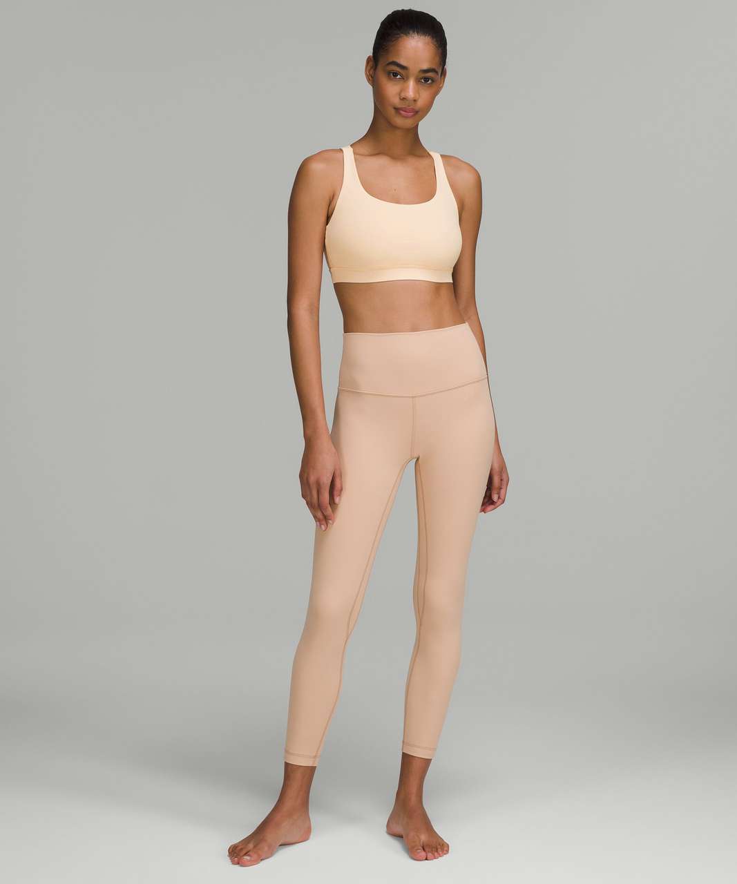 https://storage.googleapis.com/lulu-fanatics/product/73046/1280/lululemon-energy-bra-medium-support-b-d-cups-pale-linen-052870-390941.jpg