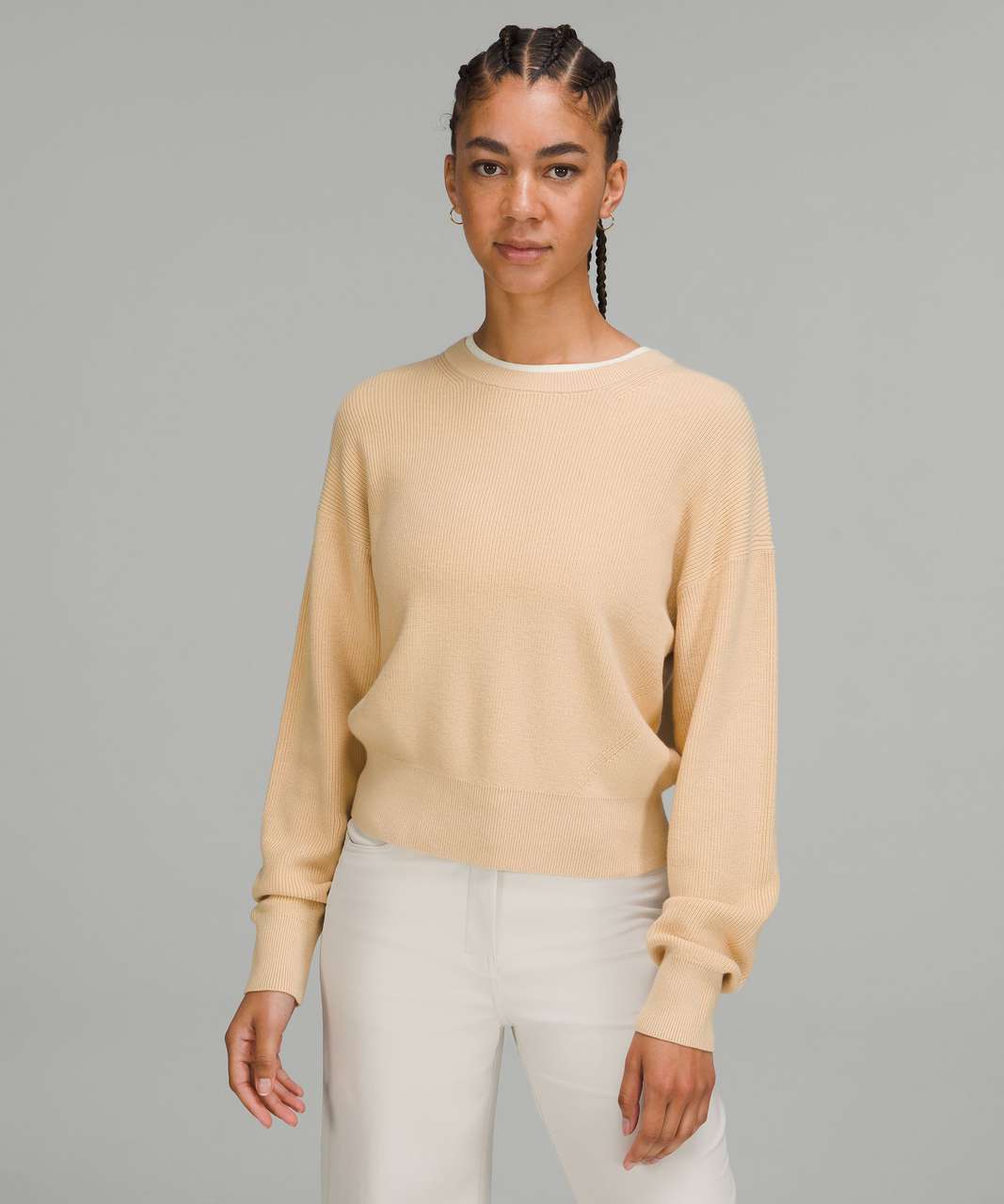 https://storage.googleapis.com/lulu-fanatics/product/74330/1280/lululemon-waist-length-crewneck-sweater-prosecco-lemon-sorbet-053340-396994.jpg