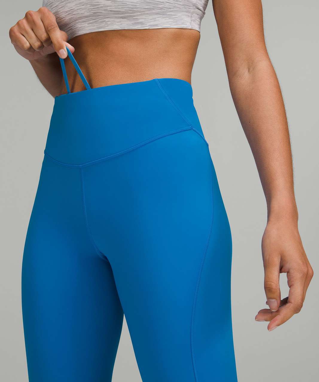 Some new things I spotted in my local store today. New Swiftly Tech SS (2)  thats really cool looking (unknown color😂) and Base Pace HR Crop 23” in symphony  blue (4) : r/lululemon