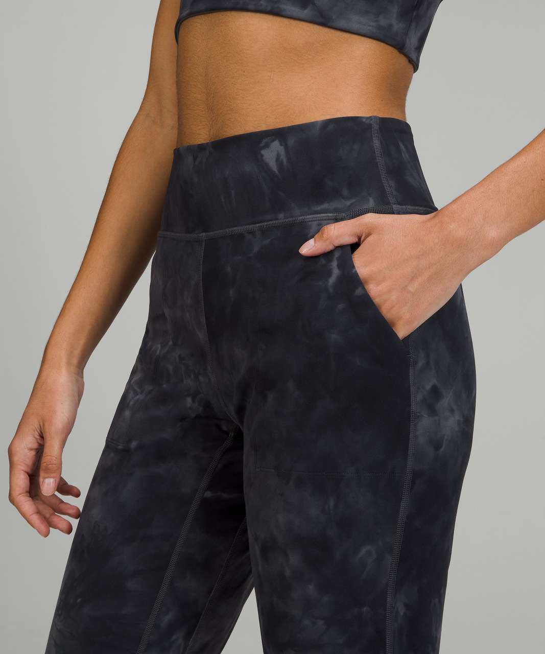 Photos of the align track stripe joggers in graphite grey/diamond dye in  size 10! I am usually a TTS 8 in leggings but sized up because the 8 was  too tight on