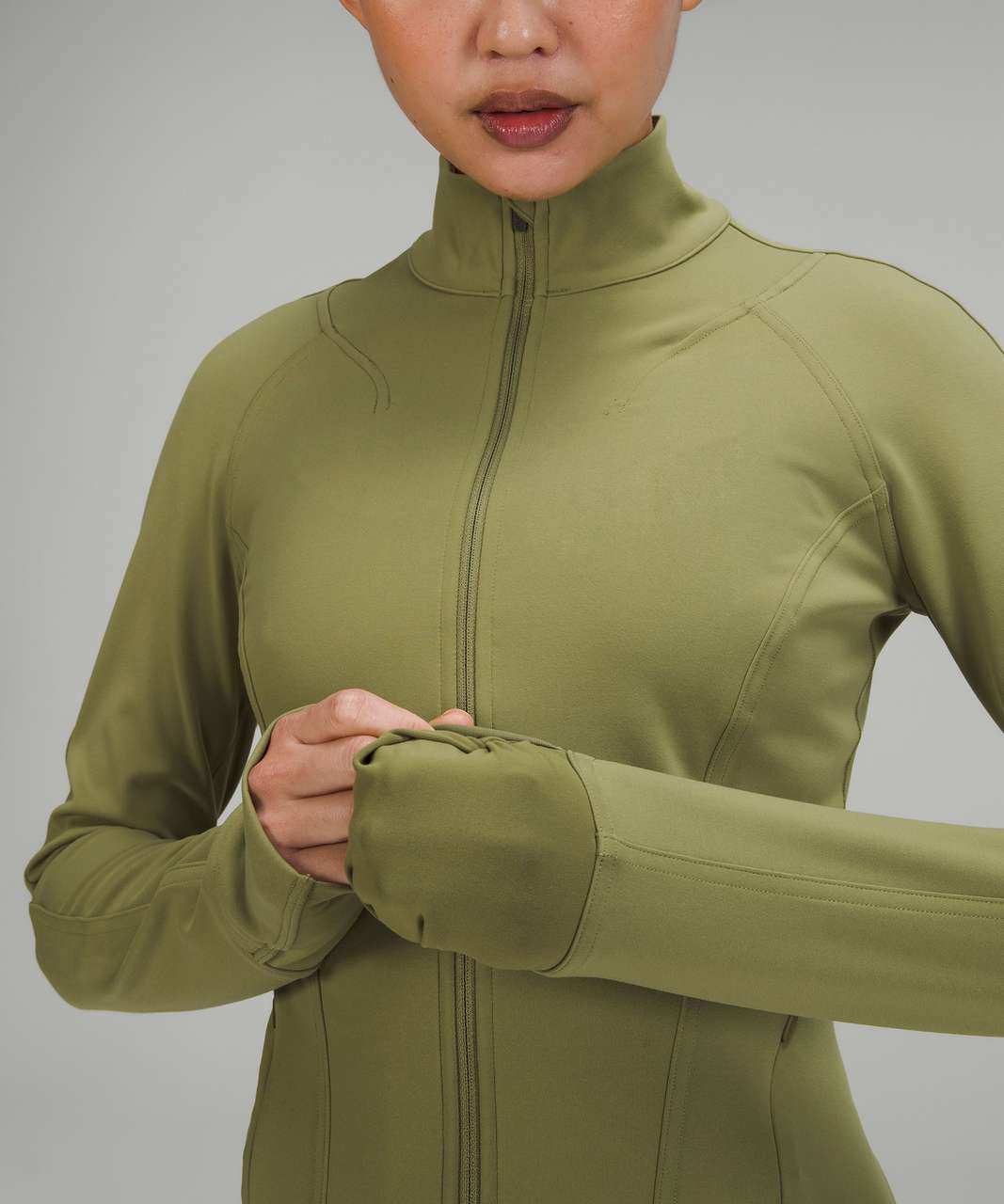 https://storage.googleapis.com/lulu-fanatics/product/75885/1280/lululemon-instill-jacket-bronze-green-045650-404418.jpg