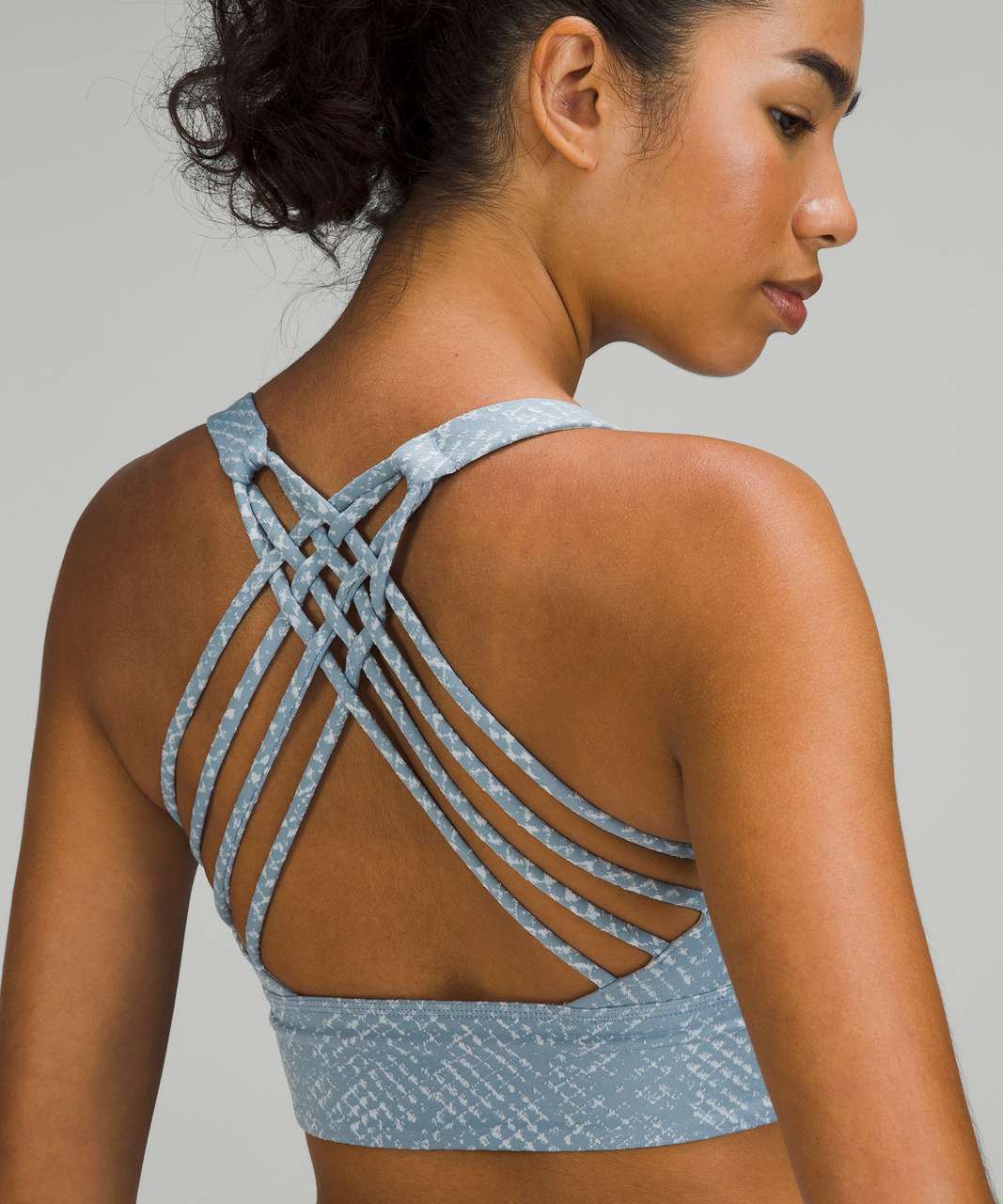 https://storage.googleapis.com/lulu-fanatics/product/76106/1280/lululemon-free-to-be-longline-bra-wild-light-support-a-b-cup-reptilia-jacquard-chambray-starlight-052626-405629.jpg