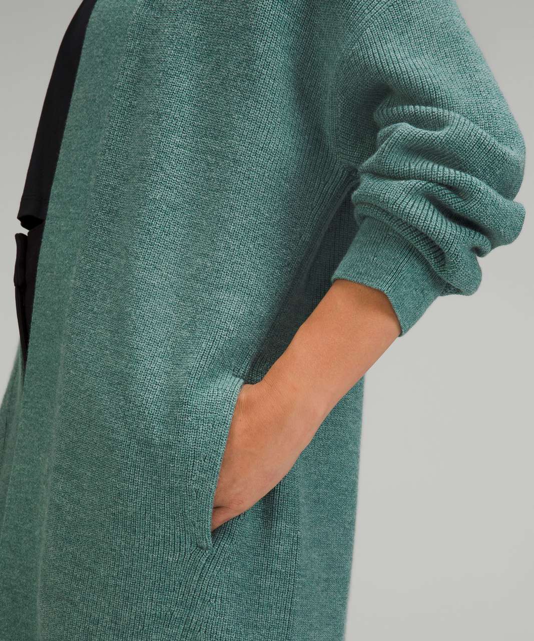 https://storage.googleapis.com/lulu-fanatics/product/77183/1280/lululemon-merino-wool-blend-ribbed-long-wrap-sweater-heathered-tidewater-teal-043877-411069.jpg