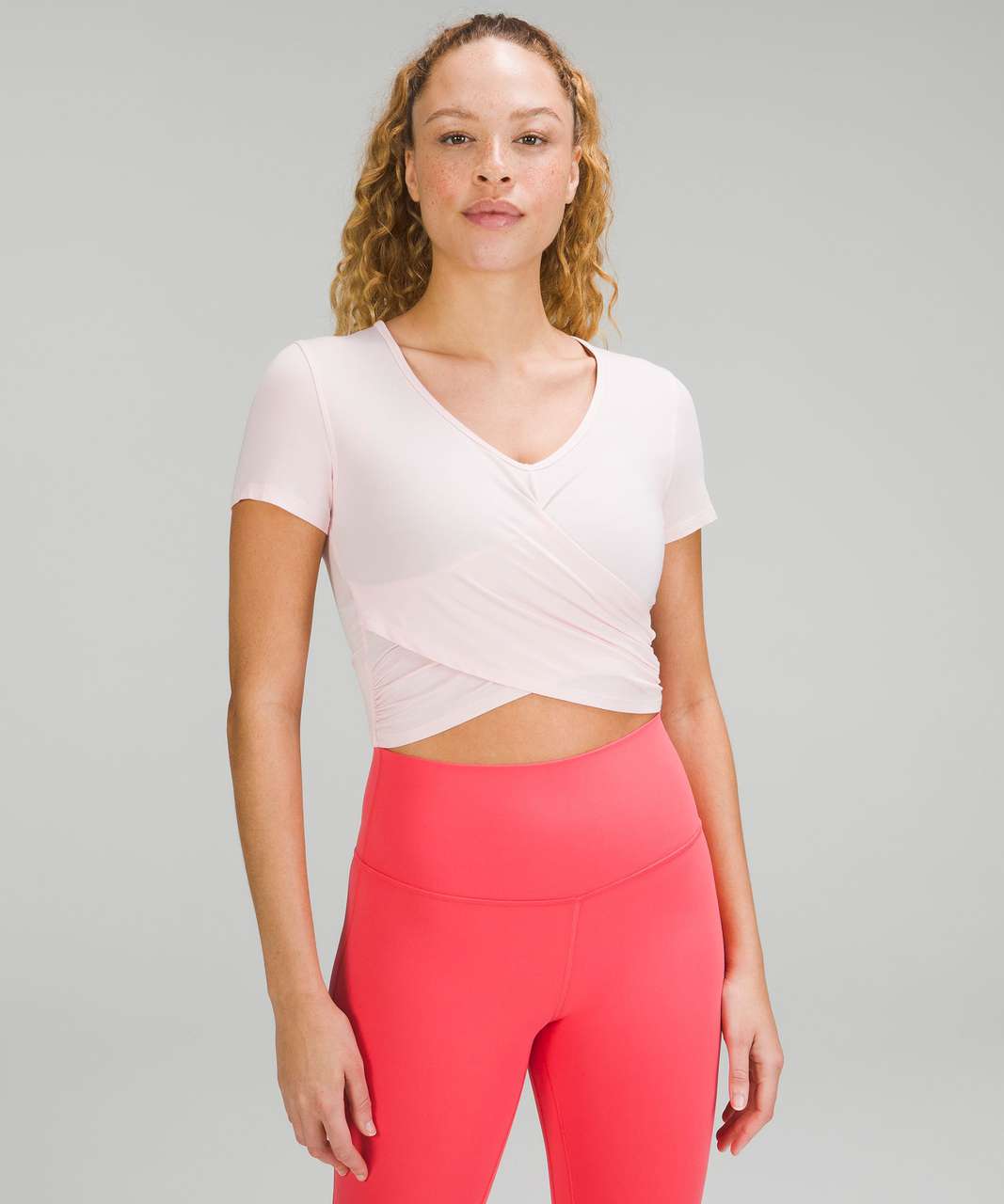 Lululemon Nulu Cropped Slim Yoga Short Sleeve Pink Size 6 - $65 New With  Tags - From Marykate