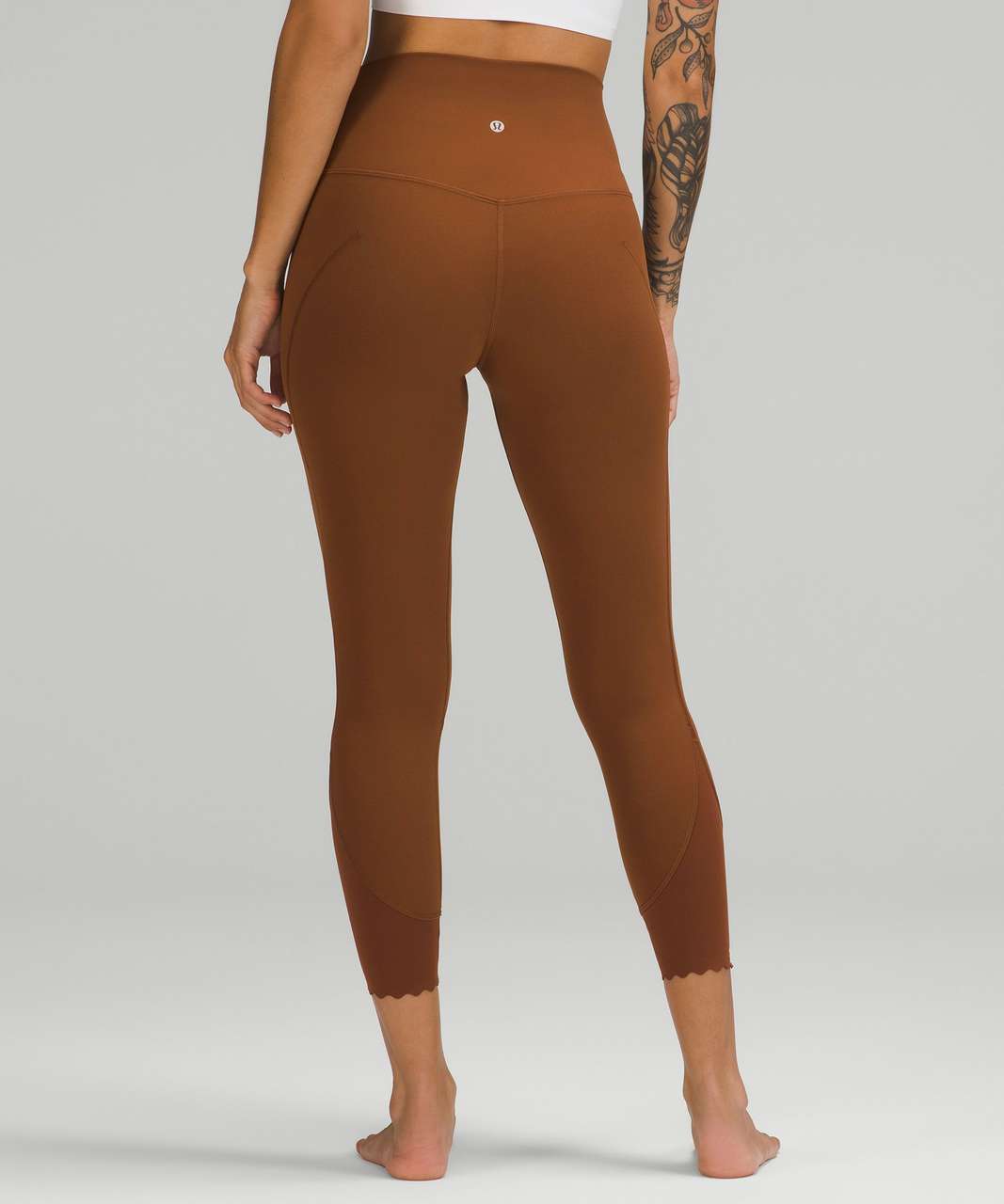 https://storage.googleapis.com/lulu-fanatics/product/78588/1280/lululemon-lululemon-align-scalloped-hem-high-rise-crop-23-roasted-brown-055842-417879.jpg