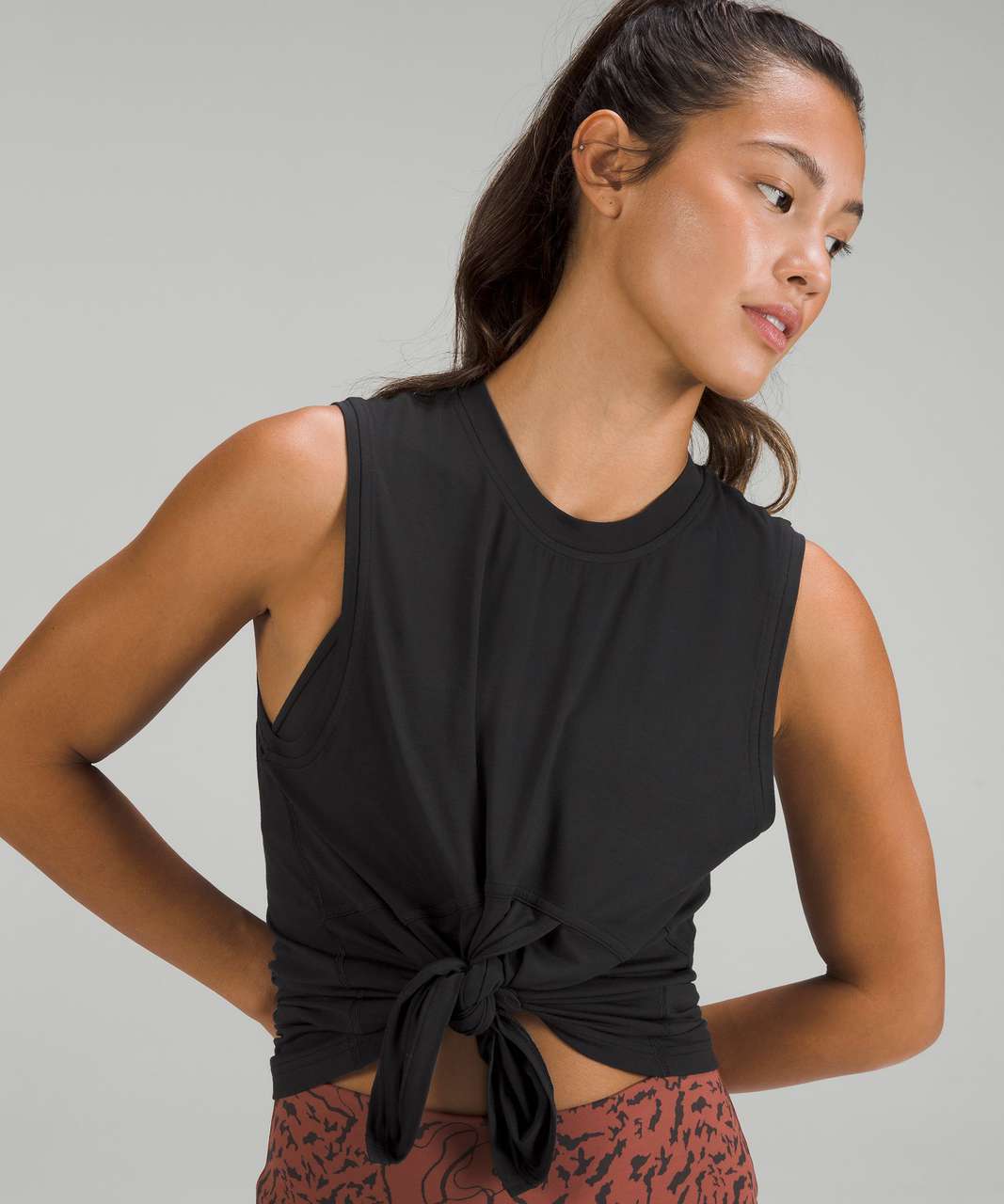 https://storage.googleapis.com/lulu-fanatics/product/78846/1280/lululemon-modal-silk-blend-tie-front-yoga-tank-top-black-0001-419259.jpg