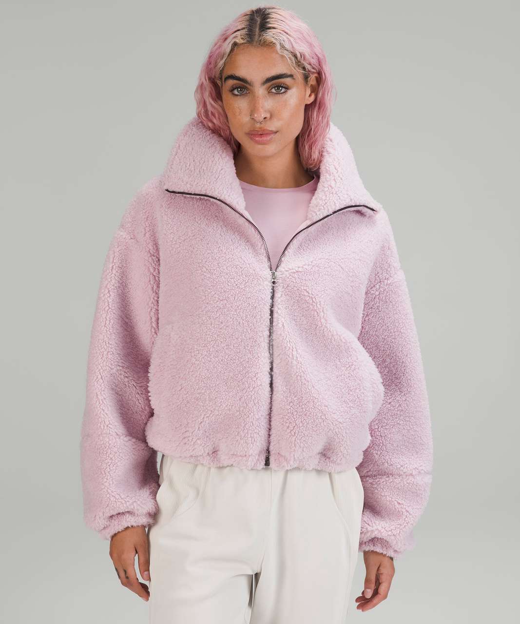 https://storage.googleapis.com/lulu-fanatics/product/79769/1280/lululemon-cinchable-fleece-zip-up-pink-peony-056496-423975.jpg