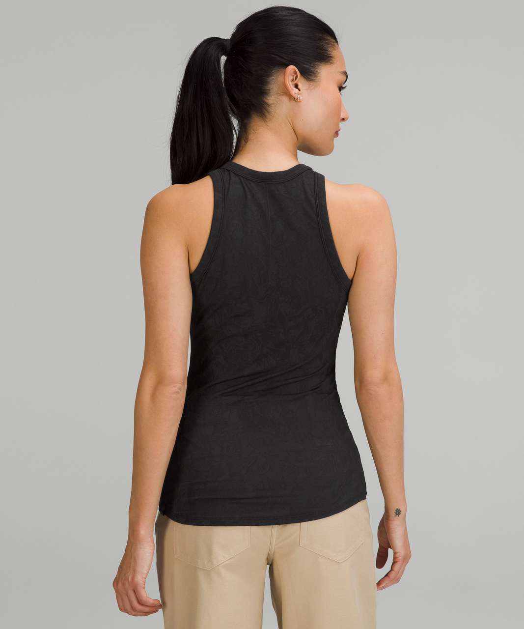 Lululemon Lululemmon black racerback tank top. Built in bra. Ruched back.  Size 6 - $30 - From Chrissy