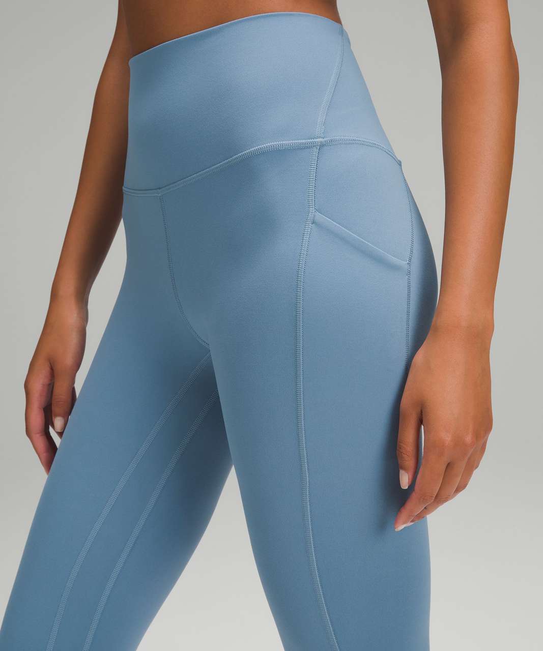 https://storage.googleapis.com/lulu-fanatics/product/84590/1280/lululemon-lululemon-align-high-rise-pant-with-pockets-28-utility-blue-036744-448884.jpg