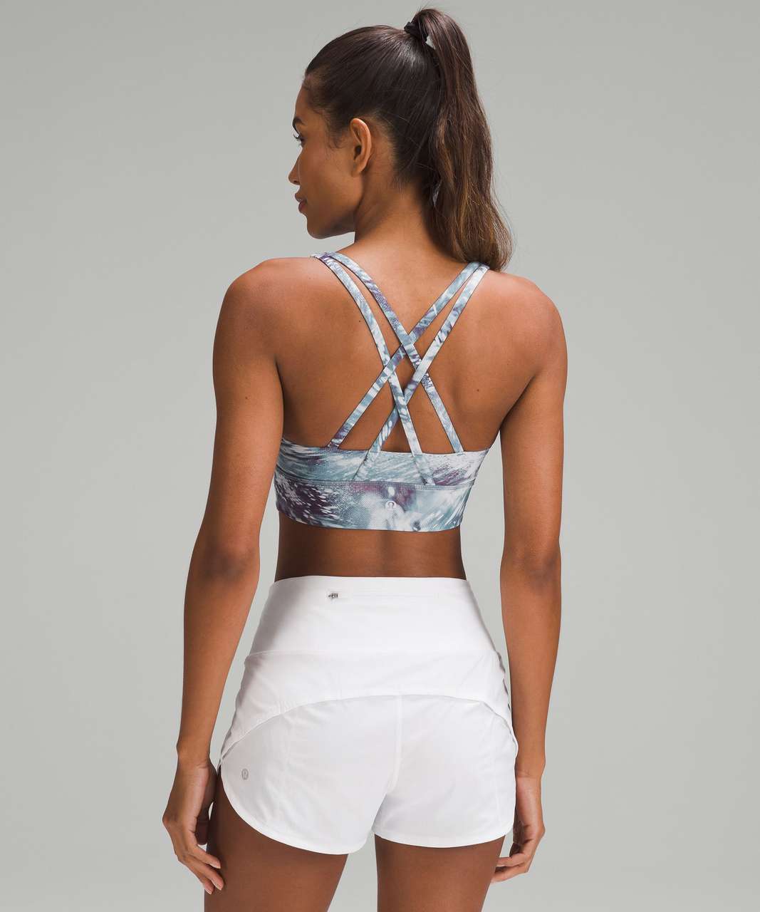 https://storage.googleapis.com/lulu-fanatics/product/85159/1280/lululemon-lululemon-energy-longline-bra-medium-support-b-d-cups-flicker-pace-utility-blue-multi-061828-451859.jpg