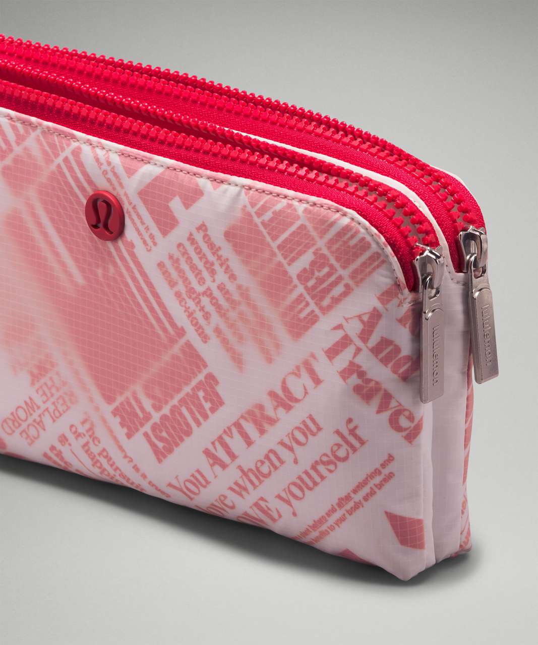 https://storage.googleapis.com/lulu-fanatics/product/85373/1280/lululemon-curved-wristlet-manifesto-print-white-lulu-red-049006-452973.jpg