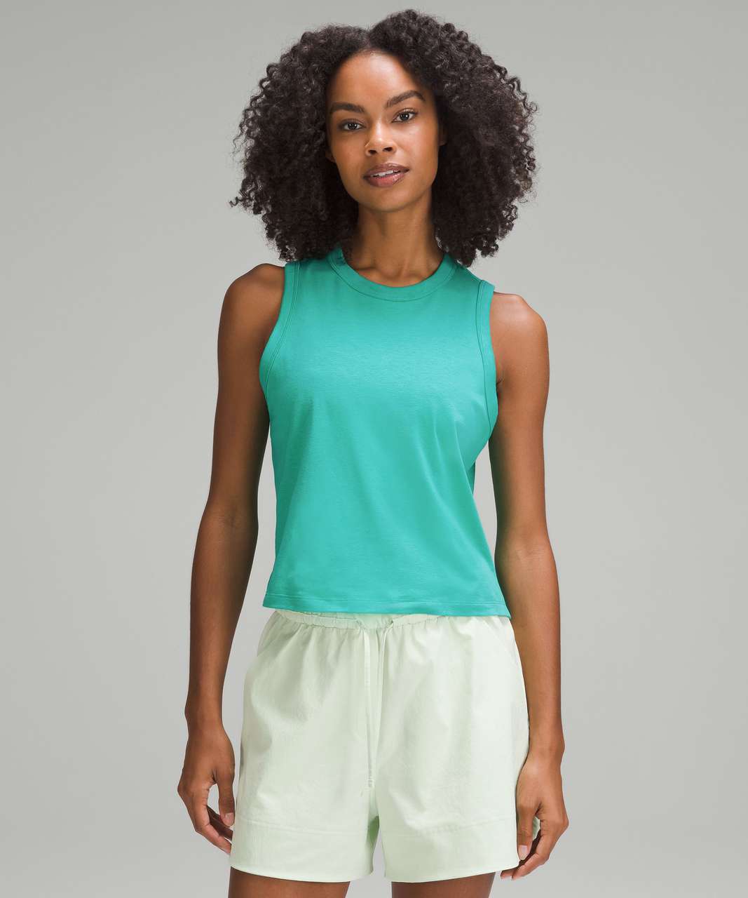 https://storage.googleapis.com/lulu-fanatics/product/85523/1280/lululemon-classic-fit-cotton-blend-tank-top-kelly-green-060997-453755.jpg