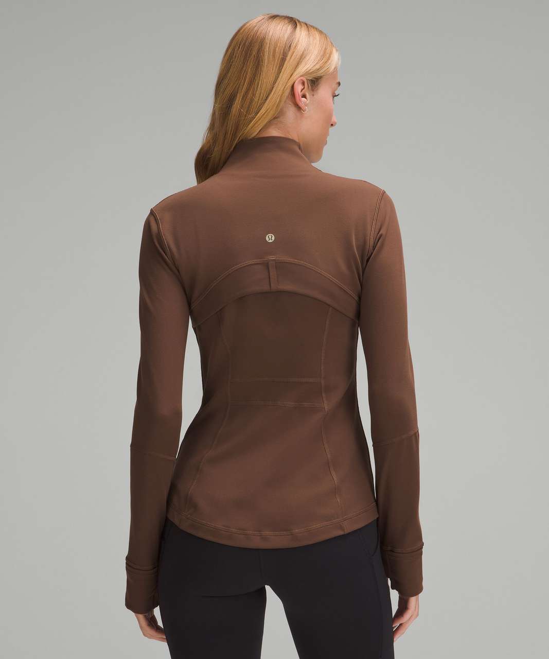 Define jacket and align leggings, both are roasted brown yet they