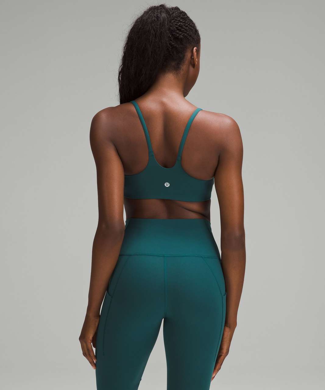 https://storage.googleapis.com/lulu-fanatics/product/88007/1280/lululemon-wunder-train-strappy-racer-bra-light-support-c-d-cup-storm-teal-063407-467319.jpg