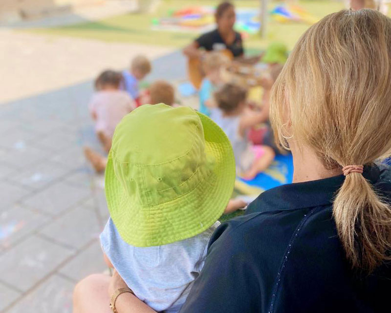 Mums and bubs participate in a music experience.