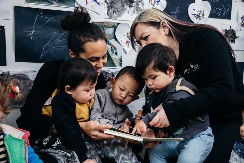 Children and Educators read children's picture books for camping tips for families.