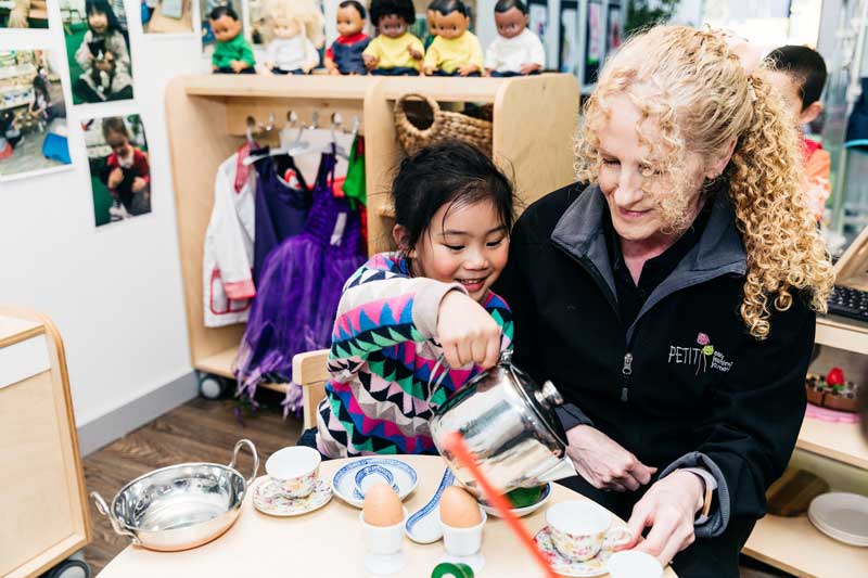 A child's rainy day idea is to share her fancy tea party with an Educator.