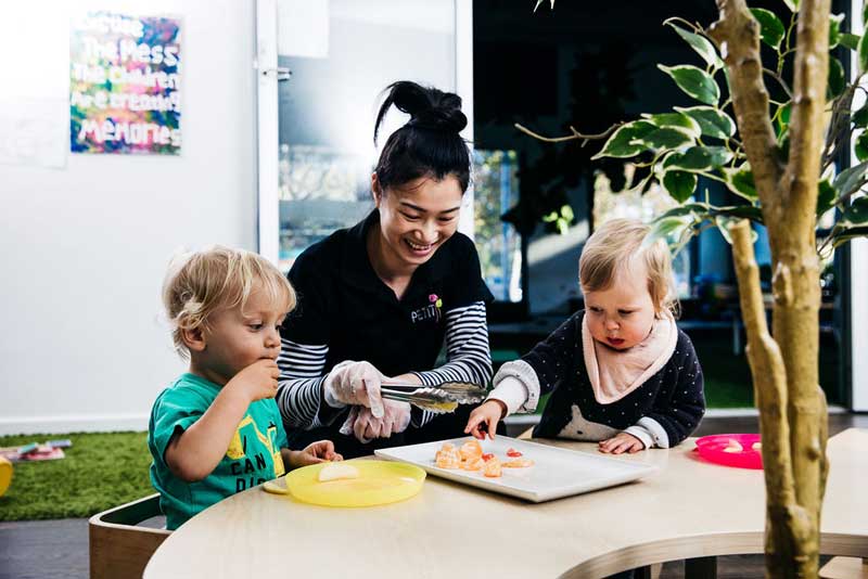 An Educator putting children first by giving them choices for afternoon tea.