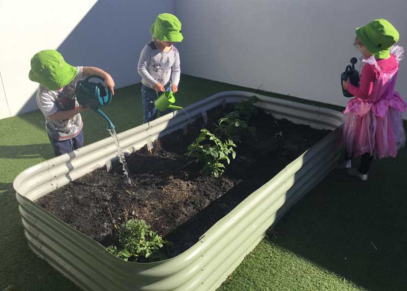 Children wearing hats to protect from the sun on Burleigh’s rooftop, an area identified as commonplace for risks and hazards.