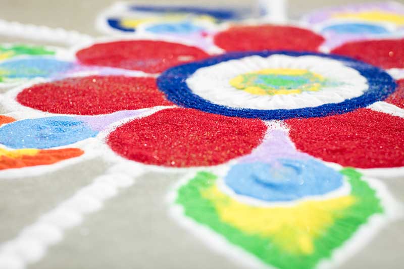 Sand art ideas like this unfixed sand picture of a flower.