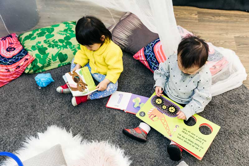 Children reading their favourite rainy day books.