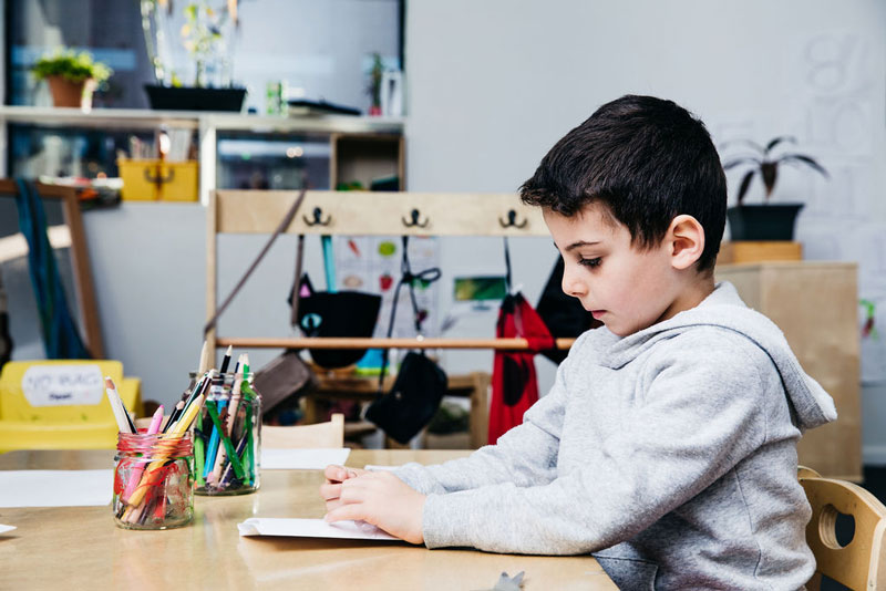 Child engages in mark making.