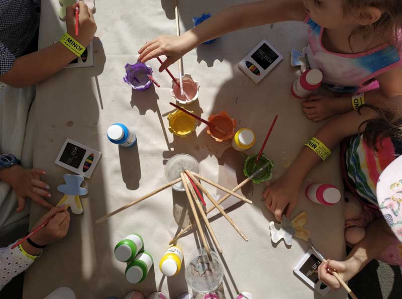 Petit ELJ Hamilton children painting at an educational programming local community event.