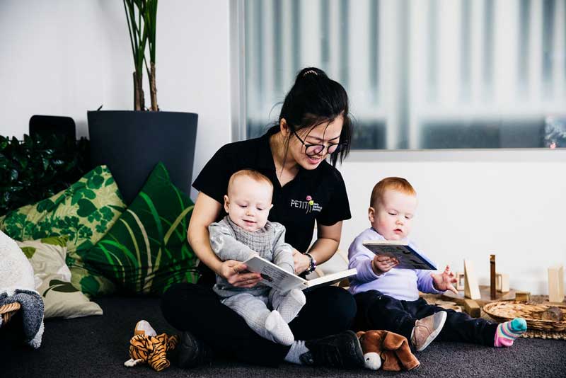 Babies develop an interest in pictures books - a 9 month old milestone.