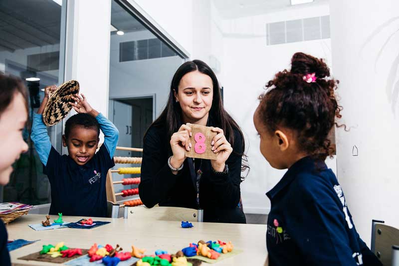 Children recite number rhymes with number learning activities to improve their numeracy skills.