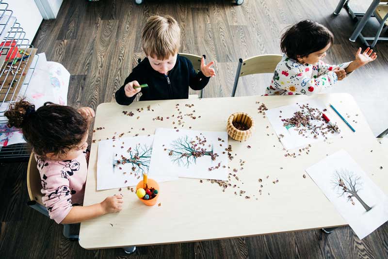 Children use natural materials for nature art and craft.