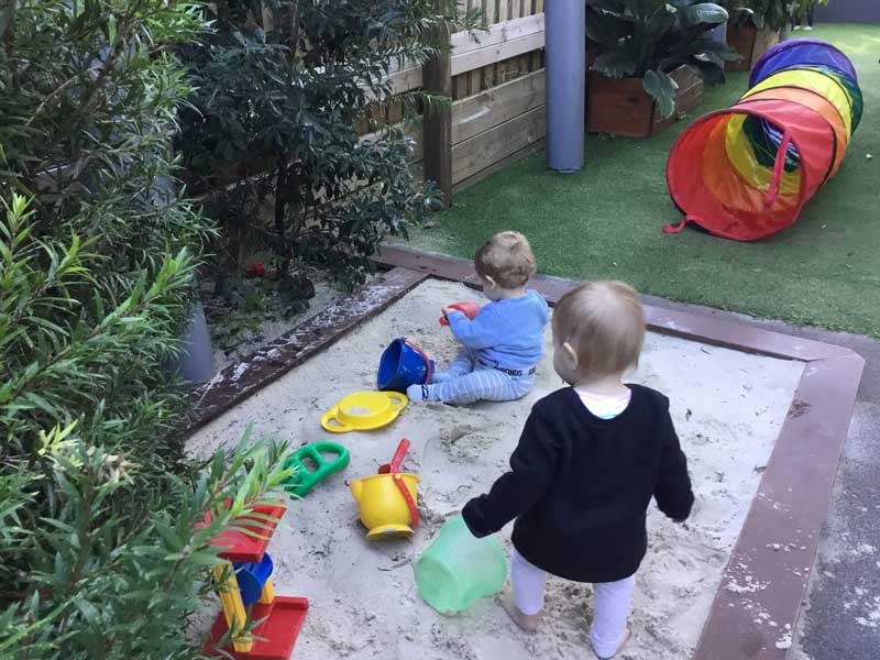 Reluctance to share while playing outside can be an early sign of sibling rivalry.