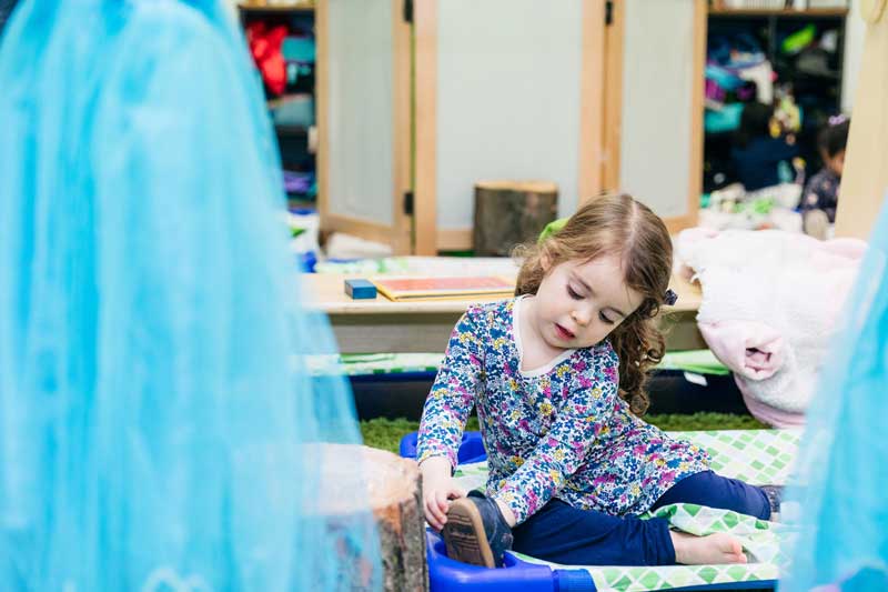 Child prepares for a nap where children's sleep meditations help children relax.