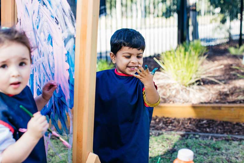 Children having fun painting makes art a much loved and easy gift idea for mums.