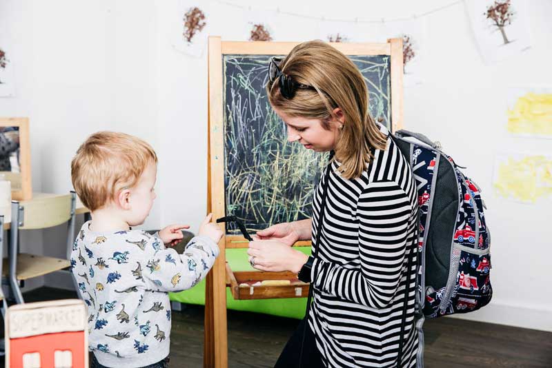 A parent talks to her child answering questions.