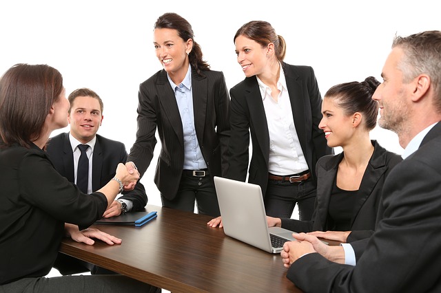 picture of corporate team shaking hands