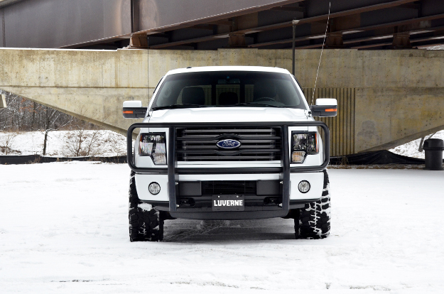 White Ford F150 in snow with black grille guard from LUVERNE