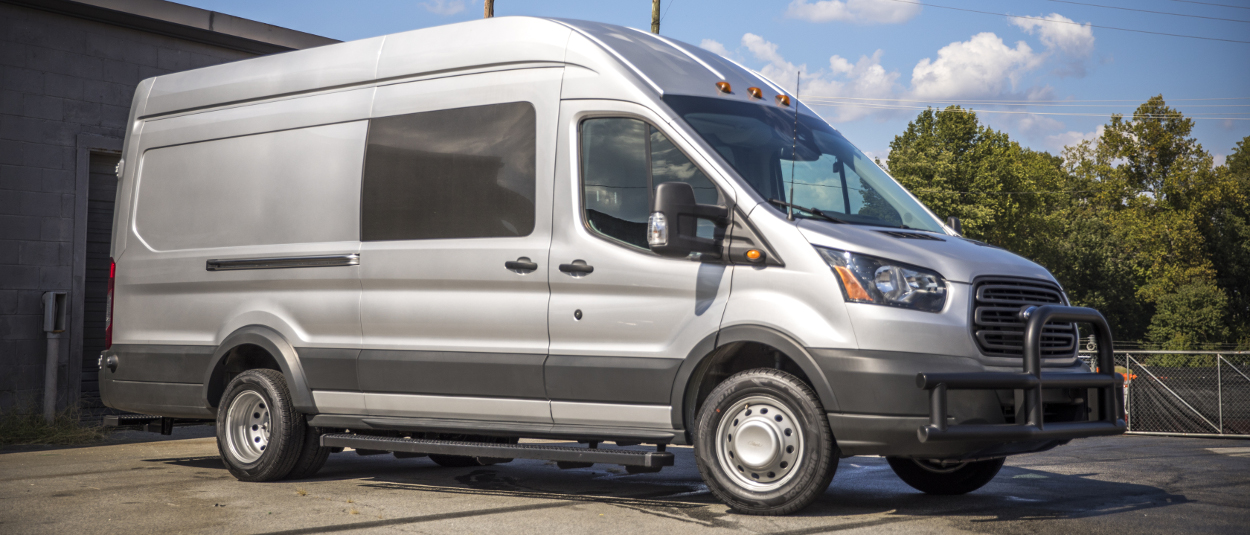 Grey 2017 Ford Transit with LUVERNE Grip Step™ van running boards