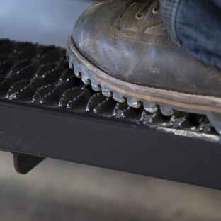 Work boot on LUVERNE Grip Step van running boards