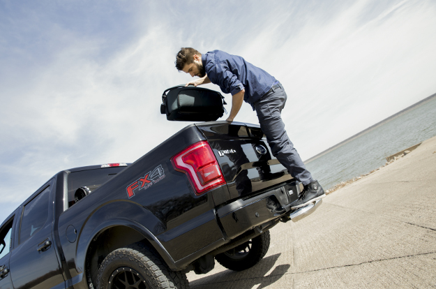 Black Ford F150 with LUVERNE MegaStep® receiver hitch step - worker