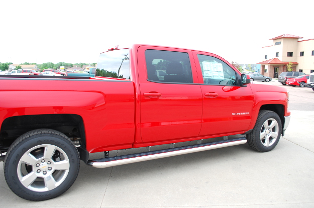 Red Chevrolet Silverado 1500 with LUVERNE MegaStep® wheel-to-wheel steps